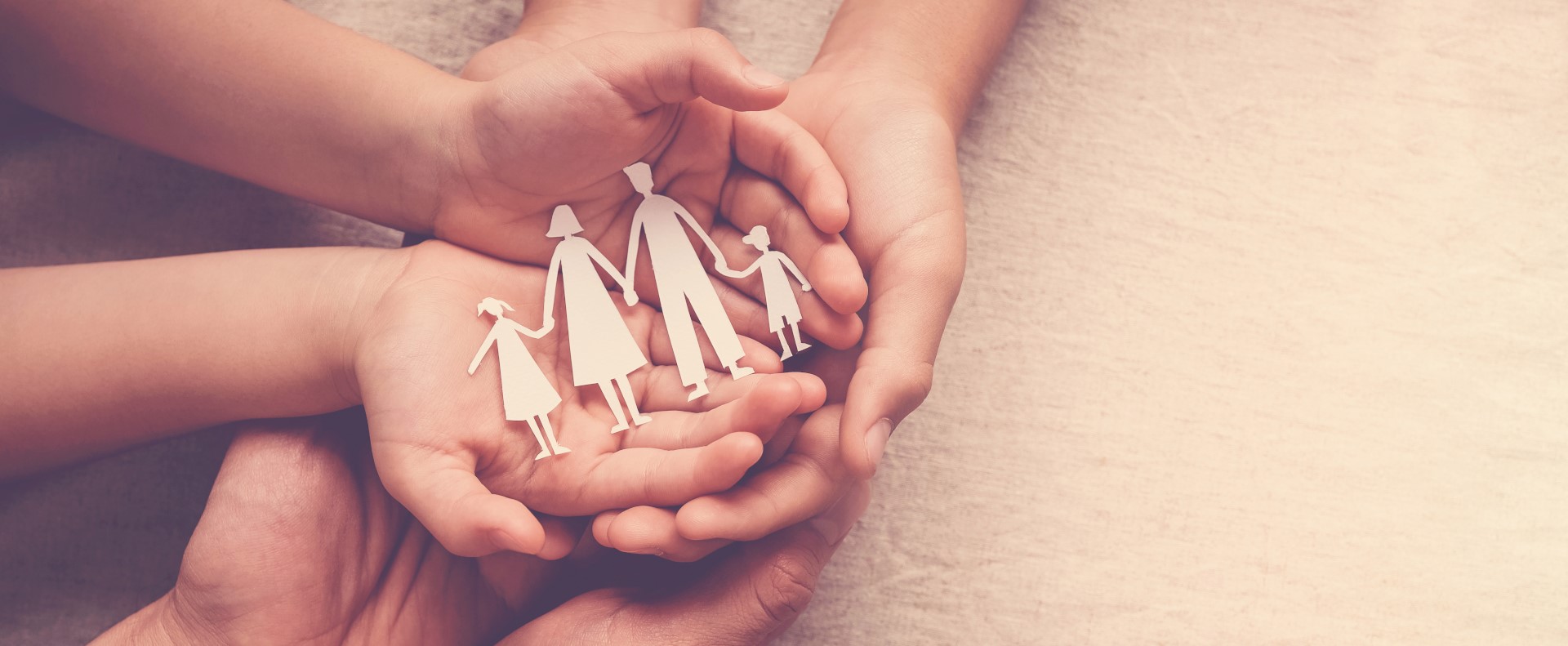 hands holding paper family cutout, family home, adoption foster care, homeless support , mental health, homeschooling , cost of living during recession concept
